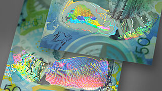 Close-up of KINEGRAM ZERO.ZERO® sample showing a butterfly and a walking man